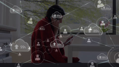Animation-of-data-processing-with-cloud-icons-over-caucasian-woman-using-smartphone