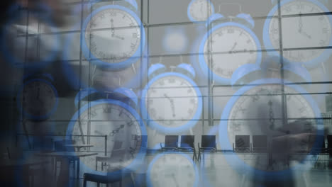Animation-of-blue-digital-clocks-over-time-lapse-of-people-walking-in-office