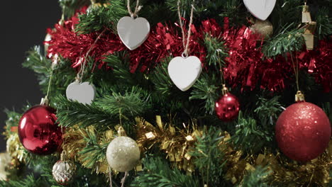 Video-of-christmas-tree-with-decorations-and-hearts-with-copy-space