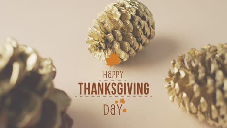 Animation-of-happy-thanksgiving-day-text-over-autumn-leaves-and-pine-cones-on-brown-background