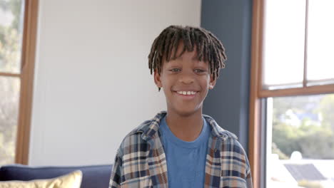 Portrait-of-happy-african-american-boy-at-home,-slow-motion