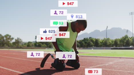 Animation-of-social-media-icons-over-african-american-man-with-prosthetic-leg-celebrating-on-track
