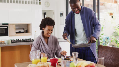 Video-of-happy-african-american-couple-eating-breakfast-together