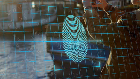 Animation-of-biometric-fingerprint-over-caucasian-woman-using-smartphone