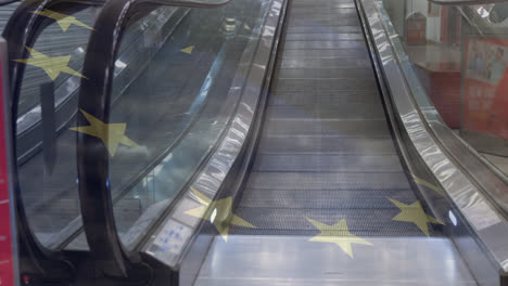 Animation-of-european-union-flag-over-escalator