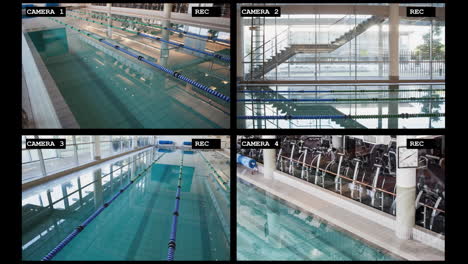 Four-security-camera-views-of-large-swimming-pool-sports-facility-interiors,-slow-motion