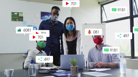 Animation-of-social-media-icons-over-portrait-of-diverse-colleagues-wearing-face-masks-at-office