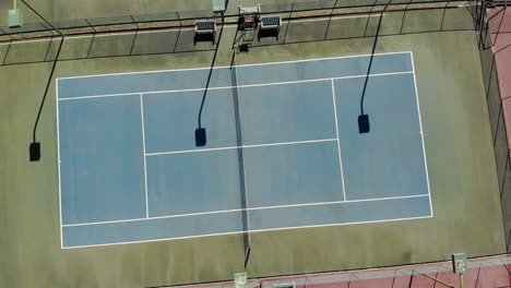 General-view-of-empty-green-tennis-court-with-lines-and-net