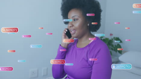 Animation-of-social-media-icons-and-data-over-african-american-woman-using-smartphone