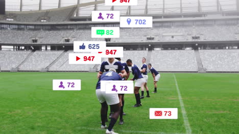 Animation-Von-Social-Media-Symbolen,-Die-Vor-Einem-Team-Verschiedener-Rugbyspieler-Schweben,-Die-Im-Stadion-Spielen