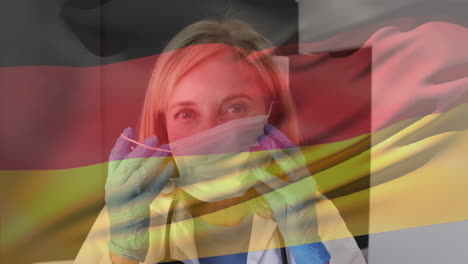 Animation-of-german-flag-and-over-caucasian-female-doctor-putting-on-face-mask