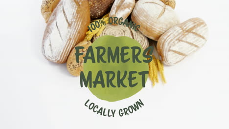 Animation-of-100-percent-farmers-market-locally-grown-text-banner-over-close-up-of-variety-of-bread