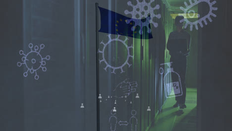 Animation-of-pandemic-icons-and-flag-of-eu-over-asian-male-worker-in-server-room