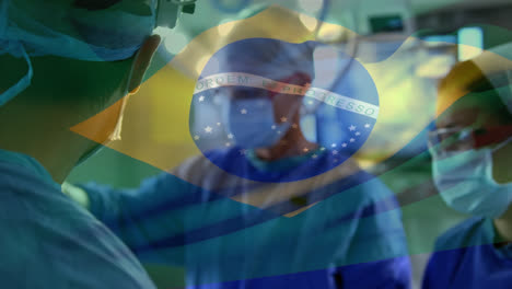 Animación-De-Ondear-La-Bandera-De-Brasil-Contra-Un-Equipo-De-Cirujanos-Diversos-Que-Realizan-Operaciones-En-El-Hospital