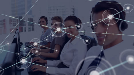 Animation-of-connected-dots-over-diverse-customer-representatives-working-on-computer-in-office