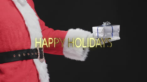Frohe-Feiertage-Text-In-Gold-über-Weihnachtsmann-Mit-Geschenk-Auf-Schwarzem-Hintergrund