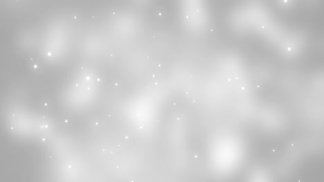 Leuchtende-Weiße-Weihnachtslichtpartikel-Fallen-Auf-Grauen-Bokeh-Hintergrund