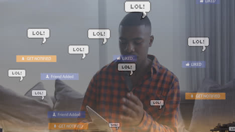 Animation-of-lol-text-in-message-boxes,-texts-in-notification-bars,-african-american-man-with-tablet