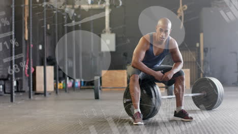 Animation-of-data-processing-on-interface-over-biracial-man-sitting-on-barbell-weights-at-gym