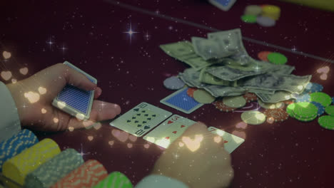 Animation-of-fairy-lights-over-mid-section-of-male-croupier-distributing-cards-at-casino-table