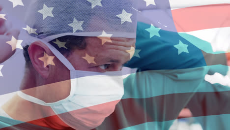 Animation-Der-Flagge-Der-Vereinigten-Staaten-Von-Amerika,-Die-über-Chirurgen-Im-Operationssaal-Weht