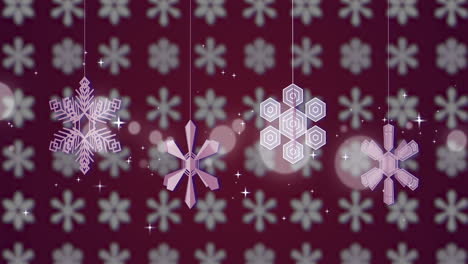 Animation-of-pink-snowflakes-spinning-on-snowflake-pattern-on-pink-background