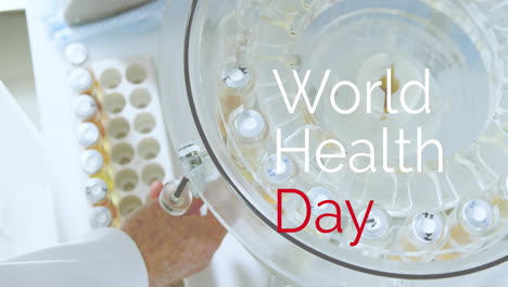 Animation-of-world-health-day-text-over-caucasian-male-scientist-collecting-test-tubes