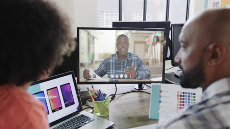 African-american-business-people-on-video-call-with-african-american-male-colleague-on-screen