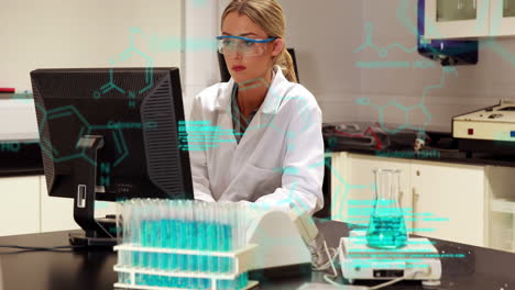 Animation-of-medical-data-processing-on-caucasian-female-scientist-using-computer-at-laboratory