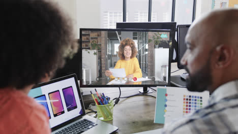 African-american-business-people-on-video-call-with-african-american-female-colleague-on-screen
