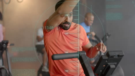 Animation-of-scanner-processing-data-over-biracial-man-cross-training-on-elliptical-at-gym