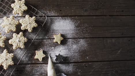 Video-of-christma-star-cookies-decorated-sugar-with-copy-space-on-wooden-background