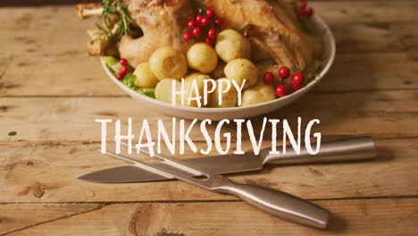Animation-of-happy-thanksgiving-over-dinner-food-and-cutlery-on-wooden-background