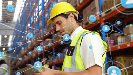 Animation-of-network-of-connections-with-icons-over-caucasian-male-worker-working-in-warehouse