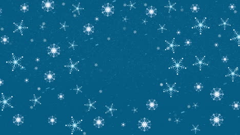 Animation-of-multiple-snowflakes-and-white-particles-against-blue-background-with-copy-space