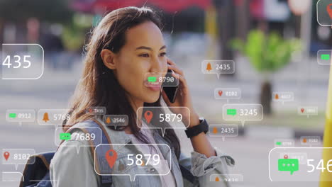 Animation-of-social-media-data-processing-over-asian-woman-using-smartphone-in-city
