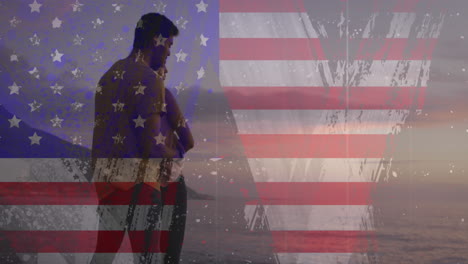 Animation-of-usa-flag-effect-against-biracial-couple-embracing-each-other-at-the-beach