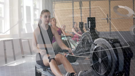 Animation-of-data-on-interface-over-caucasian-women-training-on-rowing-machines-at-gym