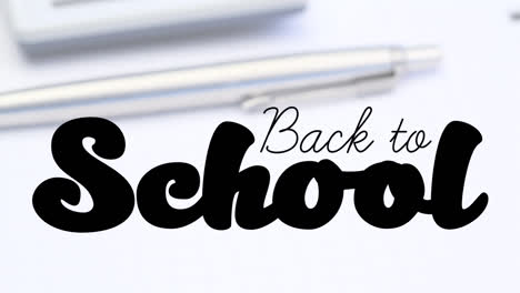 Animation-of-back-to-school-text-over-pen-on-white-background