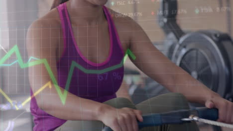 Animation-of-data-processing-on-graph-over-happy-biracial-woman-training-on-rowing-machine-at-gym