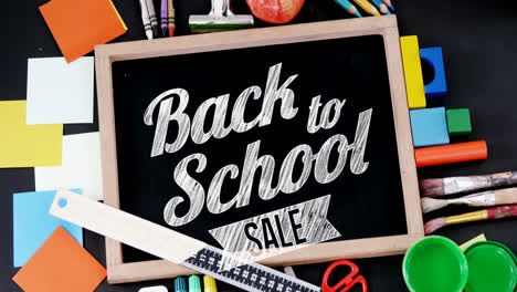 Animation-of-back-to-school-sale-text-over-school-items
