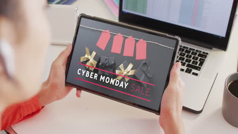 Caucasian-woman-using-tablet,-online-shopping-on-cyber-monday-sale-day,-slow-motion