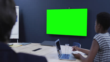 Diverse-business-people-on-video-call-with-green-screen