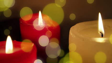 Animation-of-light-spots-over-candles-at-christmas
