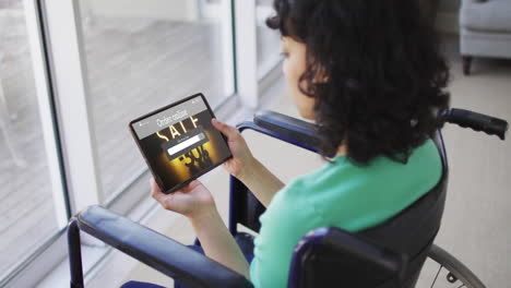 Biracial-Frau-Im-Rollstuhl-Mit-Tablet,-Online-Shopping-Während-Des-Verkaufs,-Zeitlupe