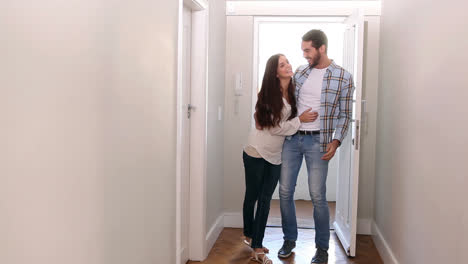 Attractive-couple-opening-the-front-door