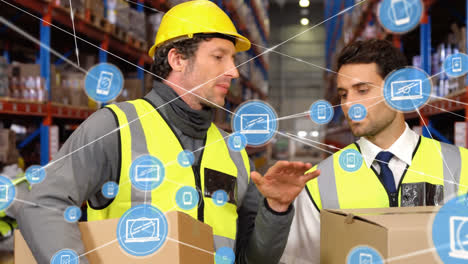 Animation-of-network-of-connections-with-icons-over-diverse-workers-working-in-warehouse