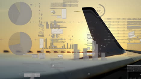 Animation-Von-Diagrammen,-Ladekreisen,-Wechselnden-Zahlen,-Handelstafel,-Nahaufnahme-Eines-Flugzeugflügels