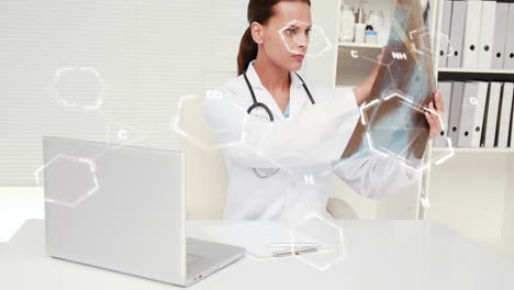 Animation-of-chemical-structures-against-biracial-female-doctor-examining-x-ray-report-at-hospital