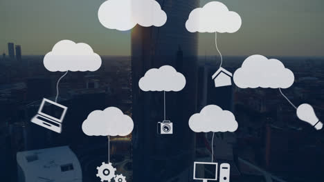 Animation-of-application-icons-hanging-with-clouds-over-aerial-view-of-skyscraper-at-sunset